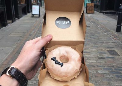 Vanilla Doughnut with a bat iced on for Shinola Detroit